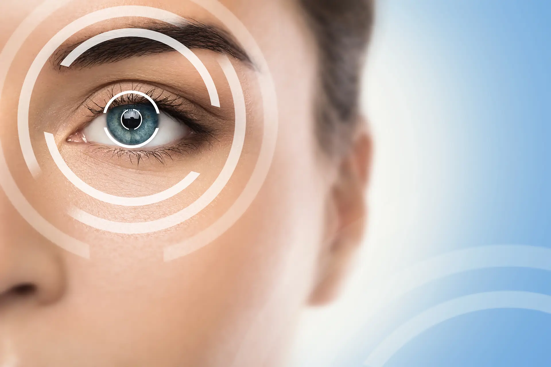 Woman's face with digital bullseye overlaid over her eye.